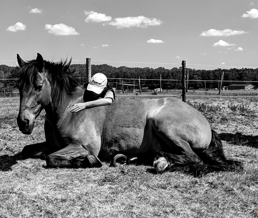 Lady looking happy with horse